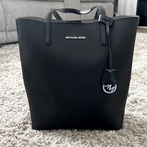 Very very cute/big bag! comes with an little wallet inside the bag!
